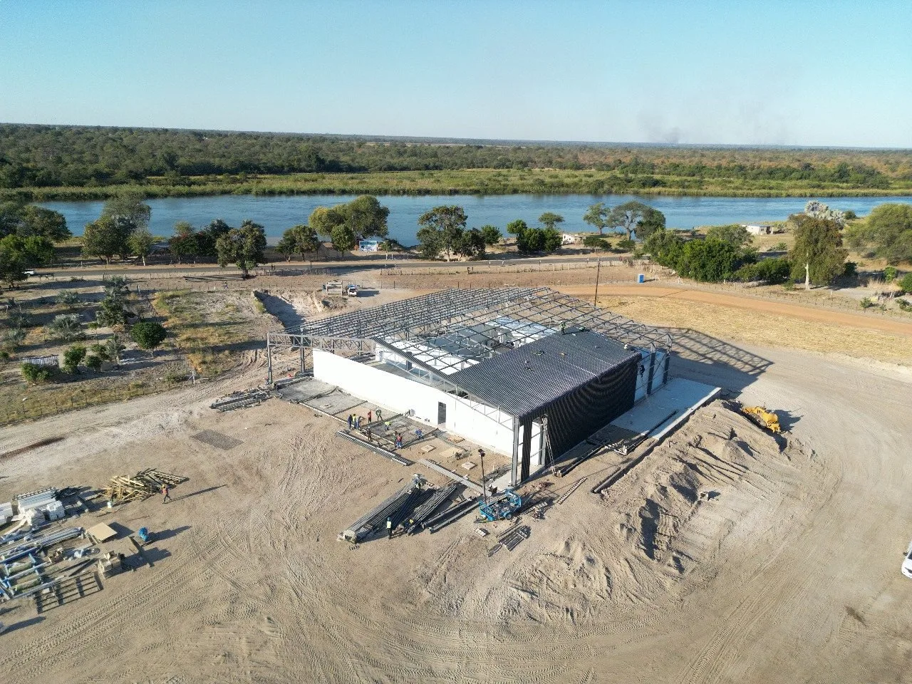 Aerial view of the new building under construction beside the Okavango River