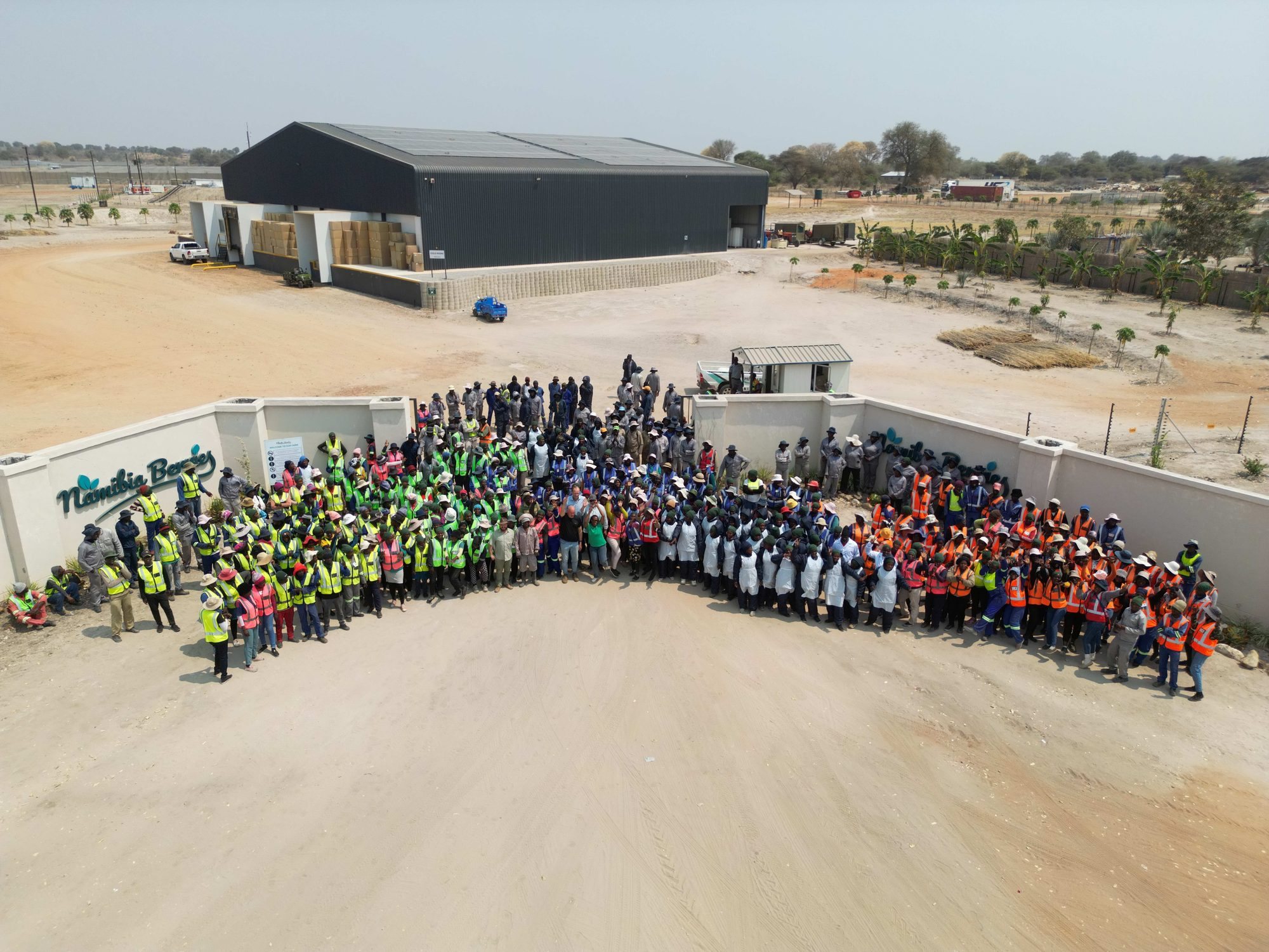 The full Namibia Berries team gathered at the farm entrance in Divundu